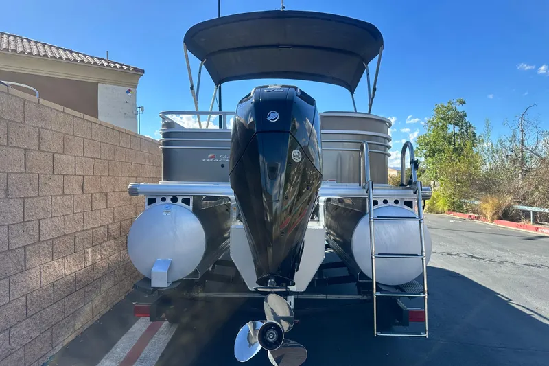 Slide: The Image of 2023 Sun Tracker Party Barge 22 RF XP3 pontoon boat on trailer, sunny day. - 6