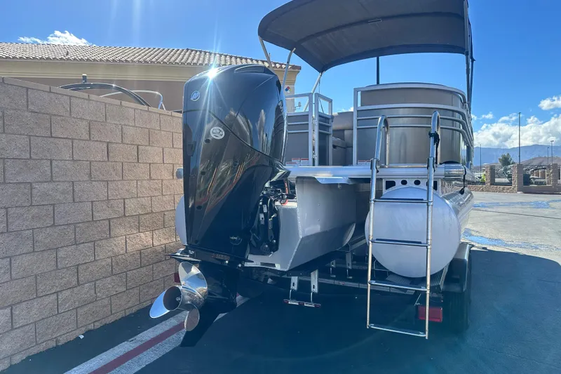 Slide: The Image of 2023 Sun Tracker Party Barge 22 RF XP3 with powerful V6 engine, parked outdoors. - 7