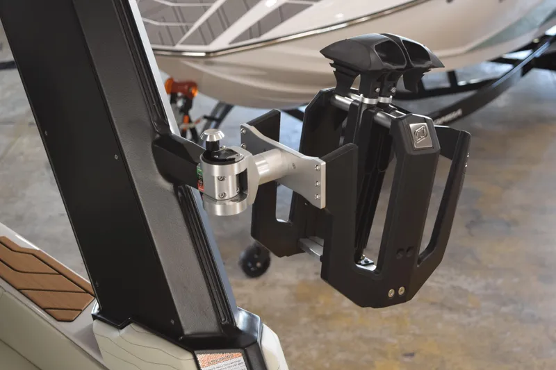 Slide: The Image of 2025 Nautique Super Air Nautique G23 wakeboard rack detail in a showroom. - 14