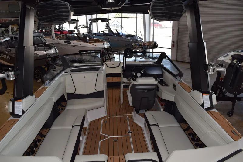 Slide: The Image of 2025 Nautique Super Air Nautique G23 interior with luxurious seating and modern dashboard. - 6