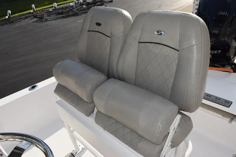 Slide: The Image of 2021 Sportsman Tournament 234 Bay Boat with dual gray cushioned seats. - 11