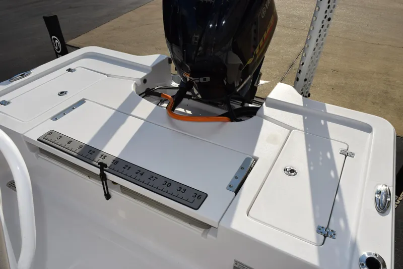 Slide: The Image of 2021 Sportsman Tournament 234 Bay Boat with measuring ruler and outboard motor. - 12