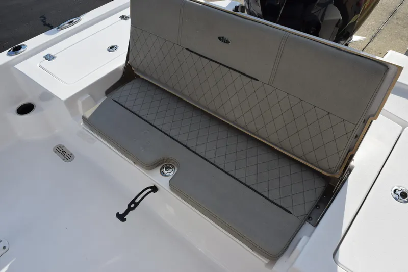 Slide: The Image of 2021 Sportsman Tournament 234 Bay Boat with cushioned seating and storage area. - 13
