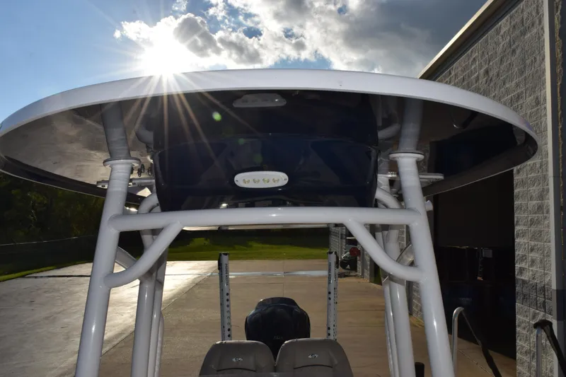 Slide: The Image of 2021 Sportsman Tournament 234 Bay Boat with T-top under bright sun. - 16
