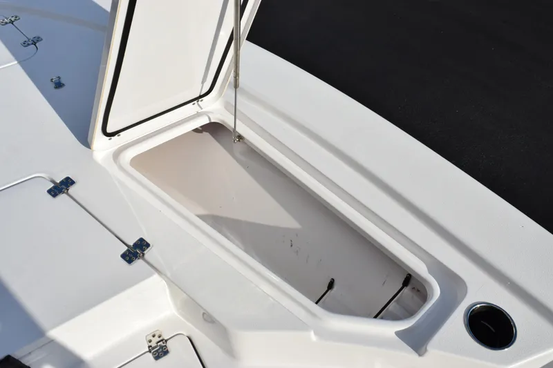 Slide: The Image of 2021 Sportsman Tournament 234 Bay Boat storage compartment with open hatch. - 17