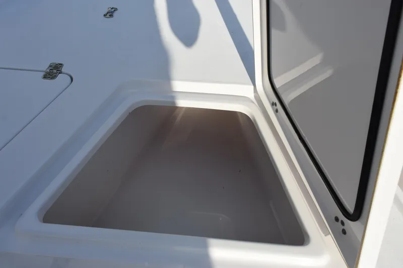 Slide: The Image of Open storage compartment on 2021 Sportsman Tournament 234 Bay Boat. - 18