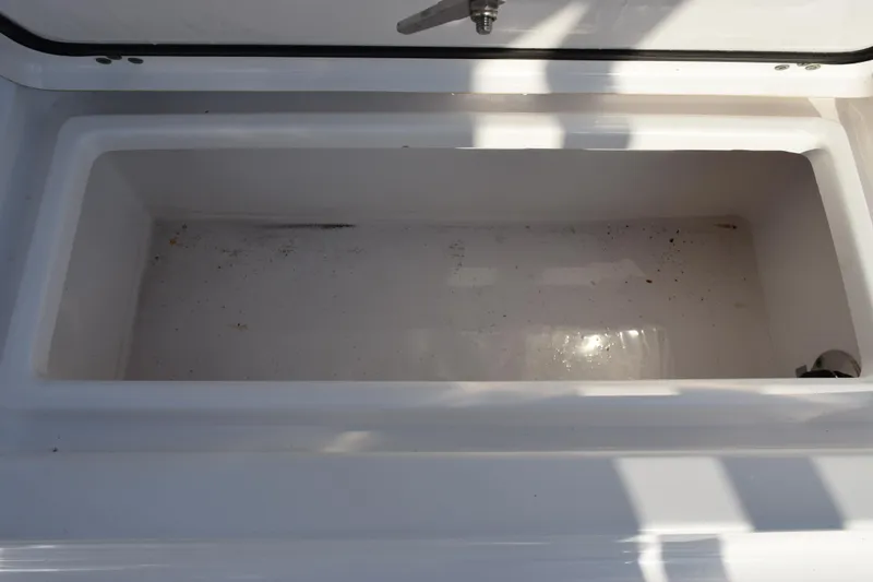 Slide: The Image of Open storage compartment on 2021 Sportsman Tournament 234 Bay Boat. - 19