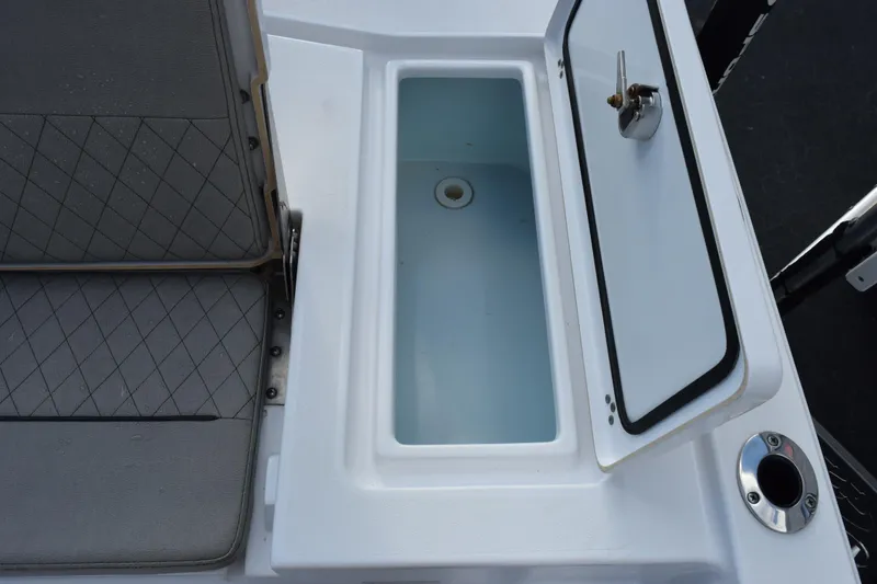 Slide: The Image of 2021 Sportsman Tournament 234 Bay Boat livewell and seating detail. - 23