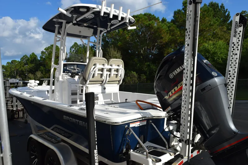 Slide: The Image of 2021 Sportsman Tournament 234 Bay Boat with Yamaha engine, parked outdoors. - 6