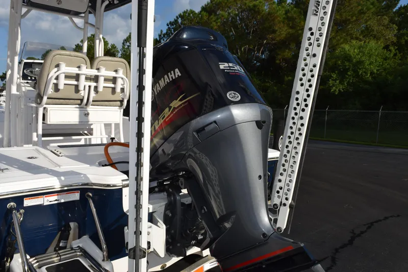 Slide: The Image of 2021 Sportsman Tournament 234 Bay Boat with Yamaha 250 engine, docked outdoors. - 7