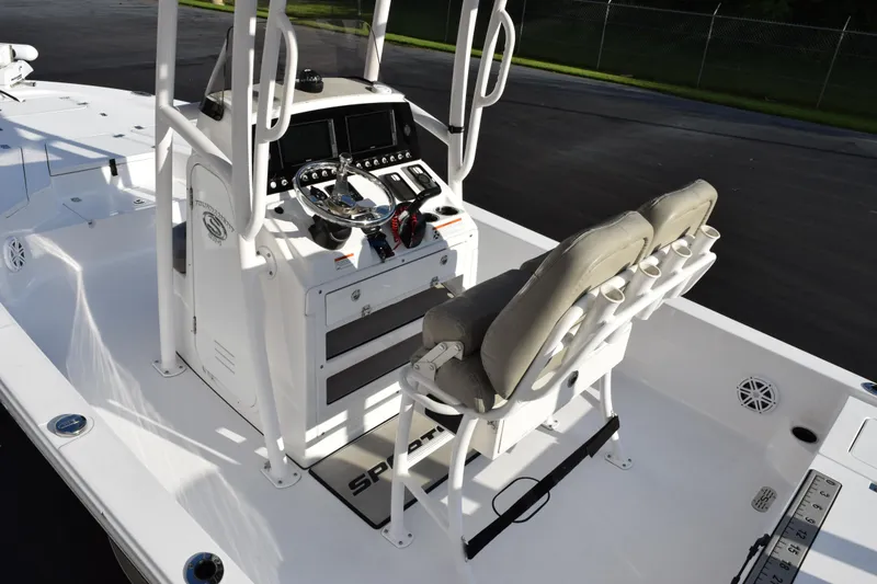 Slide: The Image of 2021 Sportsman Tournament 234 Bay Boat interior with dual seats and control panel. - 8