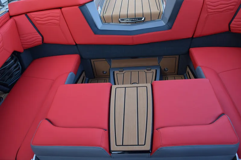 Slide: The Image of Luxurious red seating in 2025 Nautique Super Air Nautique G23 boat interior. - 10