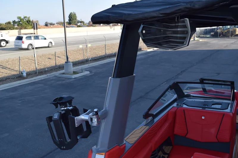 Slide: The Image of 2025 Nautique Super Air Nautique G23 boat with red interior and advanced speaker system. - 19