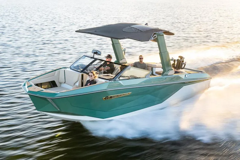 Slide: The Image of Manufacturer Provided Image: 2025 Nautique Super Air Nautique G23 speeding on water with passengers. - 24