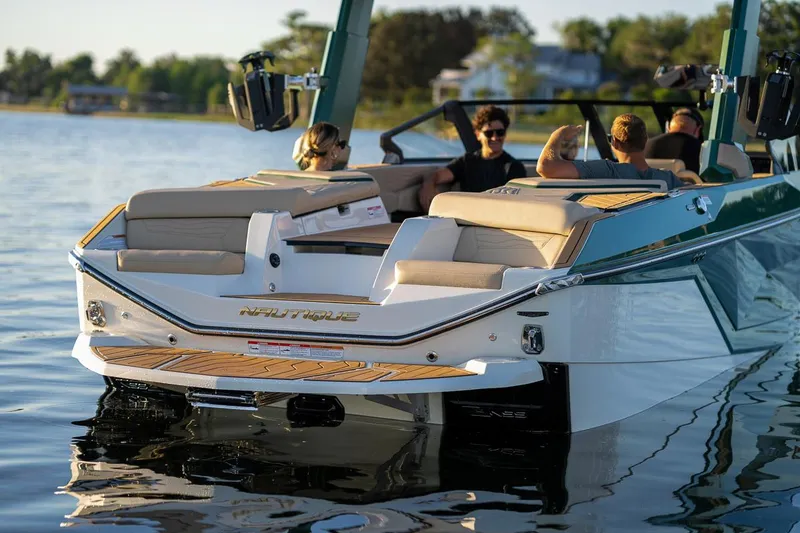 Slide: The Image of Manufacturer Provided Image: 2025 Nautique Super Air Nautique G23 boat on water with passengers enjoying leisure time. - 28