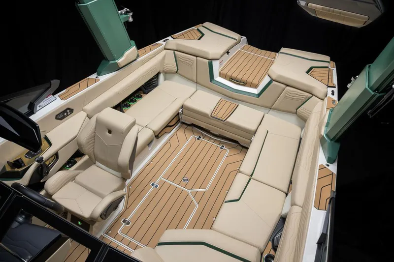 Slide: The Image of Manufacturer Provided Image: Luxurious interior of 2025 Nautique Super Air Nautique G23 boat with beige seating and teak flooring. - 33