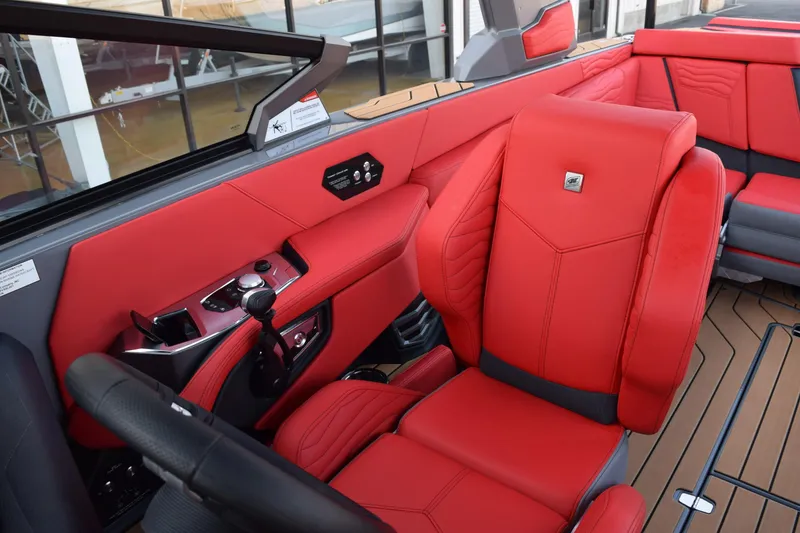 Slide: The Image of 2025 Nautique Super Air Nautique G23 interior with red leather seats and modern controls. - 6