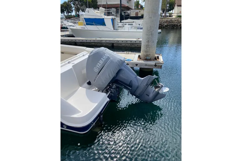 Slide: The Image of 2014 Robalo R222 Center Console with Yamaha outboard motor at dock. - 14
