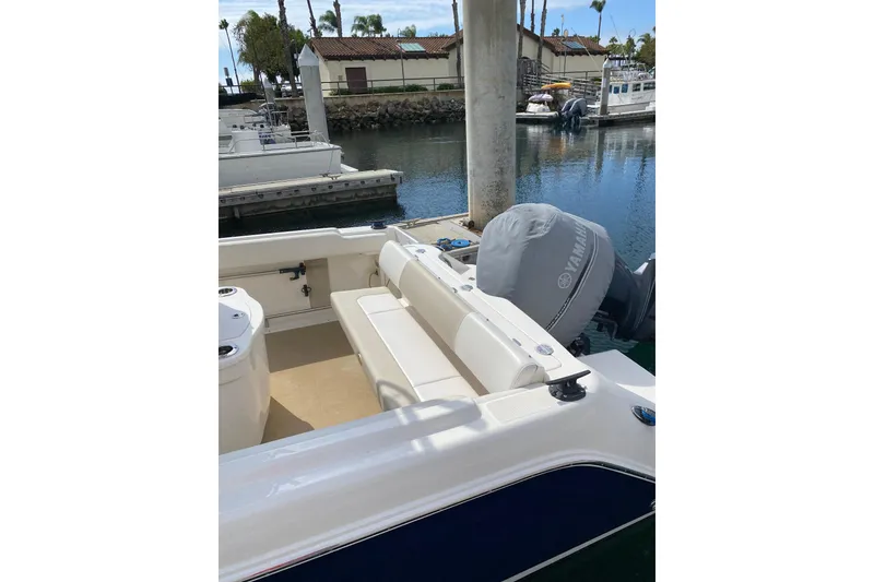 Slide: The Image of 2014 Robalo R222 Center Console boat docked with Yamaha engine cover. - 15