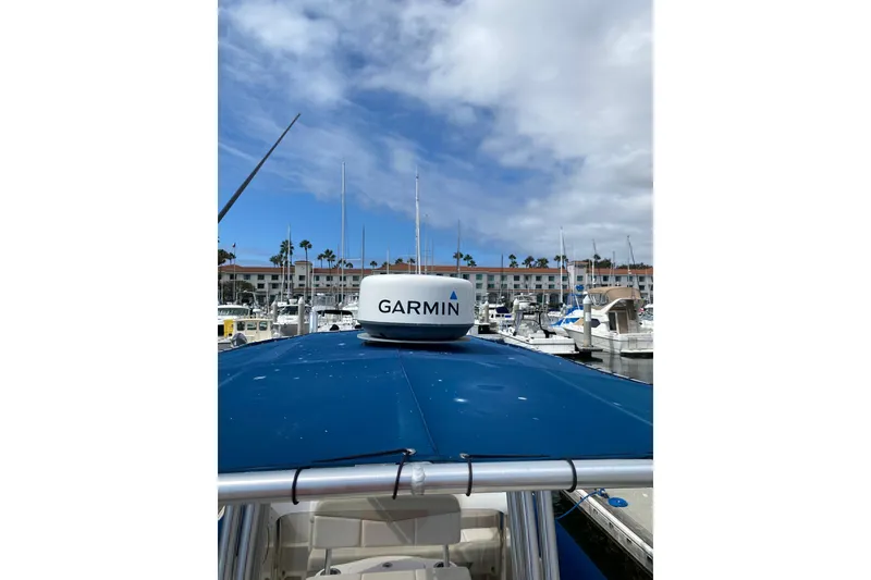 Slide: The Image of 2014 Robalo R222 Center Console boat with Garmin radar at marina. - 16