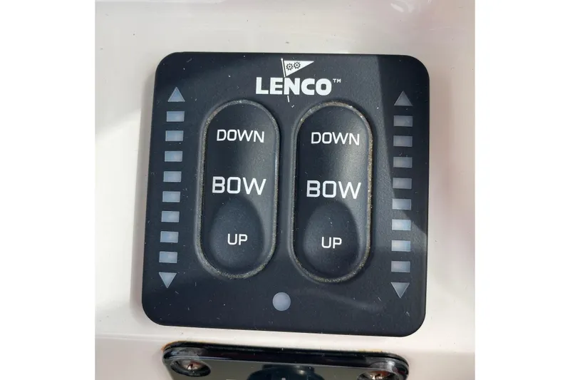 Slide: The Image of Lenco trim tab control panel on 2014 Robalo R222 Center Console boat. - 17