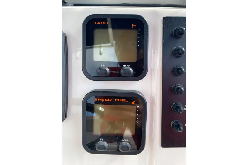 Slide: The Image of 2014 Robalo R222 Center Console dashboard with tachometer and speed fuel gauges. - 18