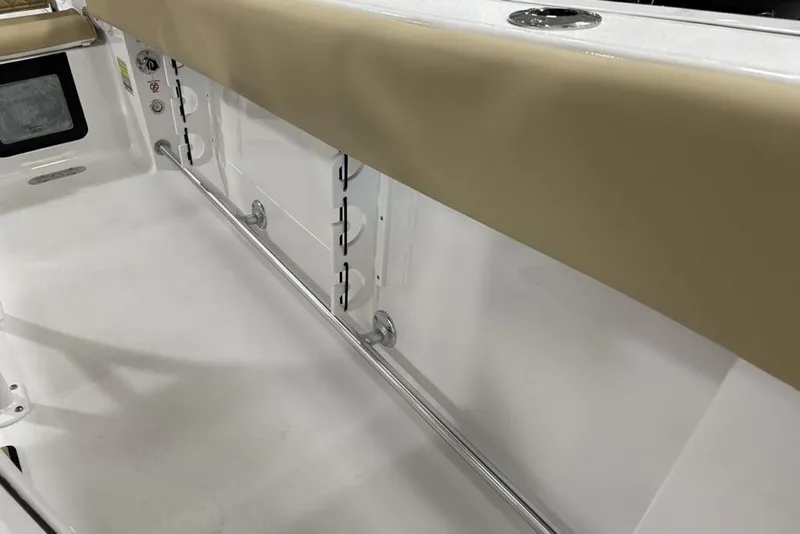 Slide: The Image of 2026 Sportsman Heritage 231 Center Console interior with beige cushioned seating and storage compartments. - 13