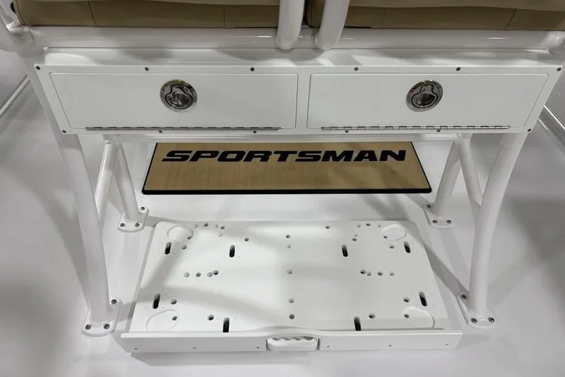 Slide: The Image of 2026 Sportsman Heritage 231 Center Console boat interior with storage compartments and logo mat. - 21