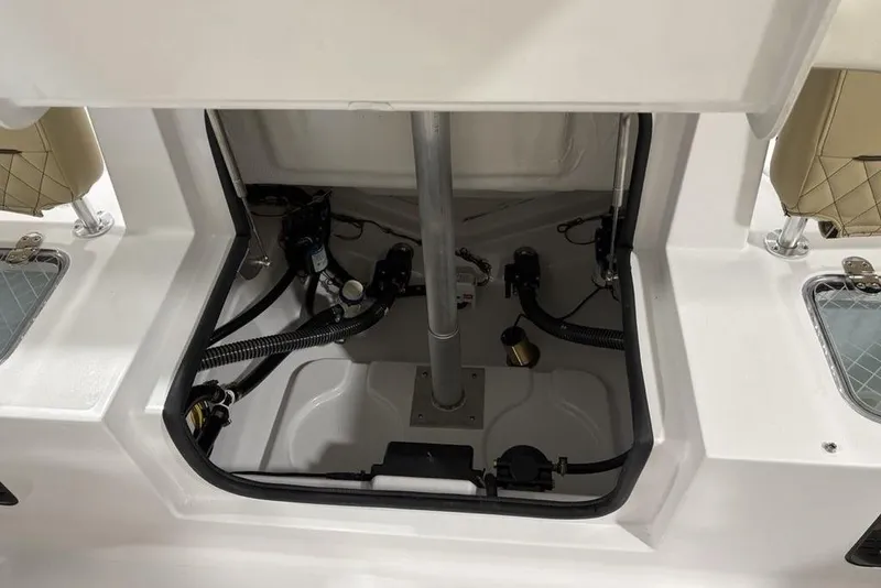 Slide: The Image of 2026 Sportsman Heritage 231 Center Console boat interior, showcasing storage and mechanical components. - 22