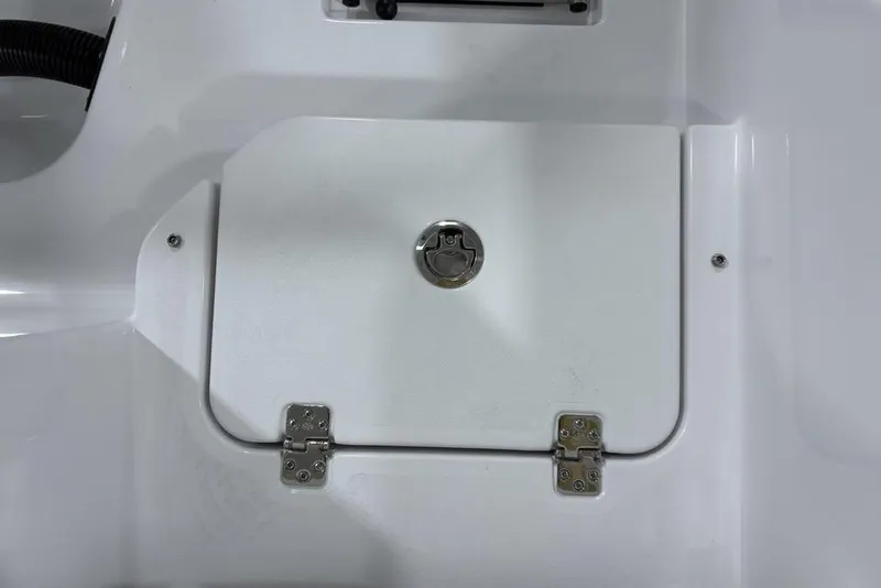 Slide: The Image of 2026 Sportsman Heritage 231 Center Console hatch with secure latch and hinges. - 27