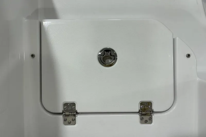 Slide: The Image of 2026 Sportsman Heritage 231 Center Console hatch with stainless steel hinges and latch. - 29