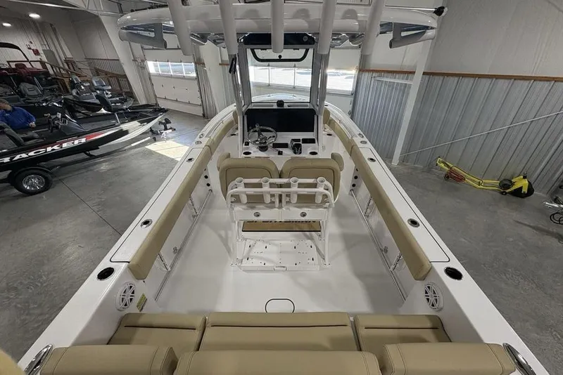 Slide: The Image of 2026 Sportsman Heritage 231 Center Console boat interior in a showroom. - 30