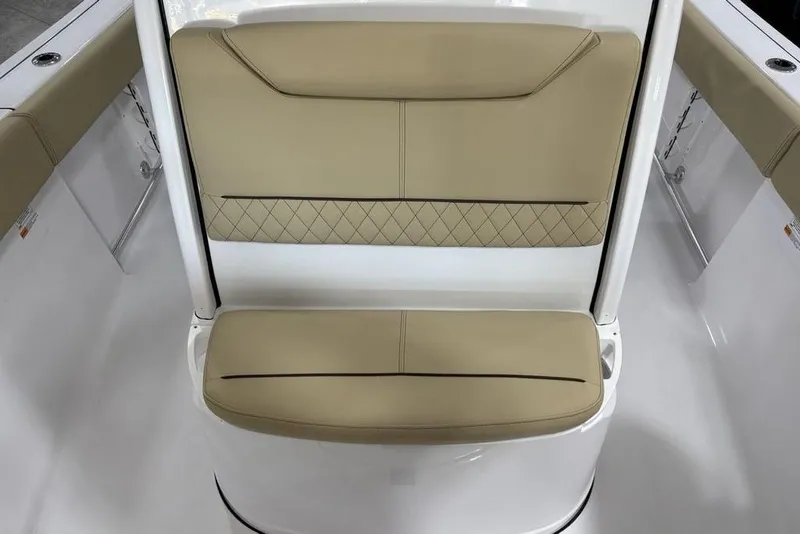 Slide: The Image of 2026 Sportsman Heritage 231 Center Console boat seat with tan upholstery and diamond stitching. - 5