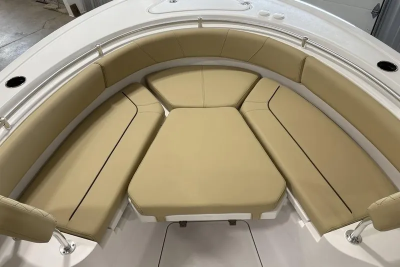Slide: The Image of 2026 Sportsman Heritage 231 Center Console boat with tan cushioned seating. - 9