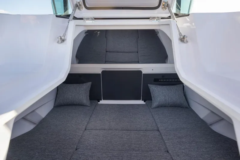 Slide: The Image of 2026 Axopar 29 XC Cross Cabin interior with gray cushions and sleek design. - 26
