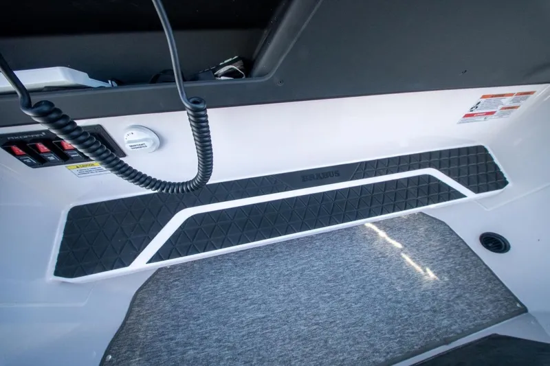 Slide: The Image of Interior view of 2026 Axopar 29 XC Cross Cabin with control panel and textured flooring. - 25