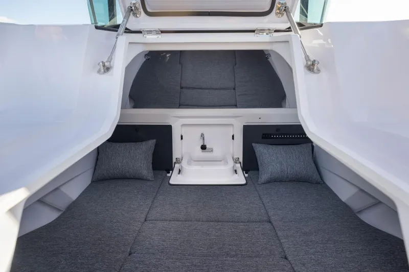 Slide: The Image of Interior cabin of 2026 Axopar 29 XC Cross Cabin, featuring modern gray upholstery. - 27