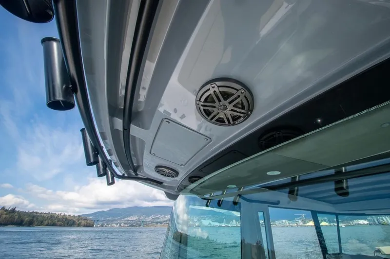 Slide: The Image of 2026 Axopar 29 XC Cross Cabin boat with sleek design and scenic water view. - 13