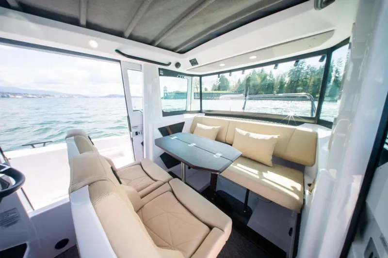 Slide: The Image of Luxurious interior of 2026 Axopar 29 XC Cross Cabin with scenic water view. - 19