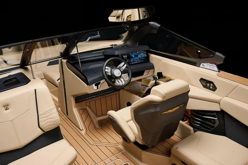 Slide: The Image of Manufacturer Provided Image: 2026 Nautique Super Air Nautique G23 interior with luxurious beige seating and advanced dashboard. - 19