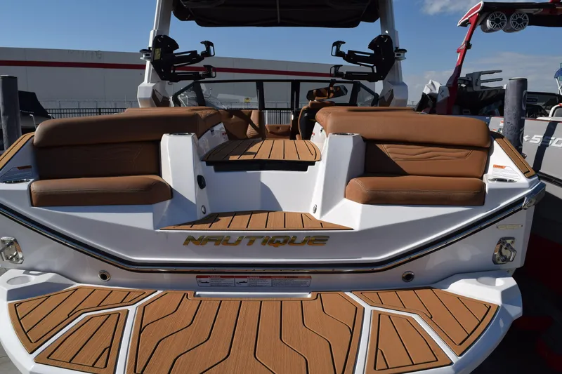 Slide: The Image of 2026 Nautique Super Air Nautique G23 boat with luxurious seating and sleek design. - 2