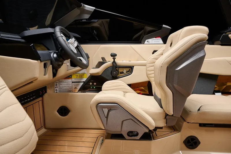 Slide: The Image of Manufacturer Provided Image: 2026 Nautique Super Air Nautique G23 interior with beige leather seats and modern dashboard. - 20
