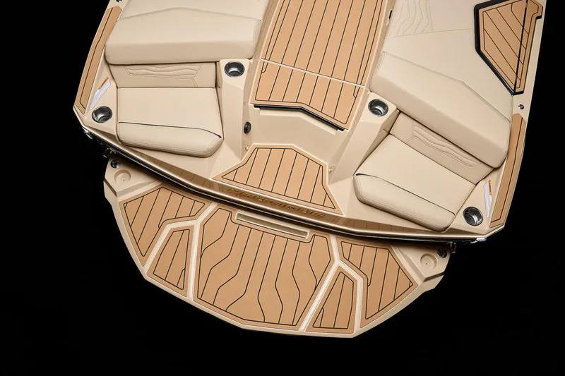 Slide: The Image of Manufacturer Provided Image: 2026 Nautique Super Air Nautique G23 boat deck with tan seating and wood accents. - 22