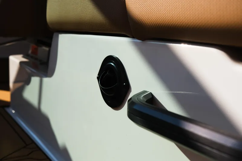 Slide: The Image of 2026 MasterCraft NXT23 interior detail with beige seating and black handle. - 36