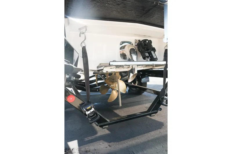 Slide: The Image of 2026 MasterCraft NXT23 boat propeller and stern view on trailer. - 7