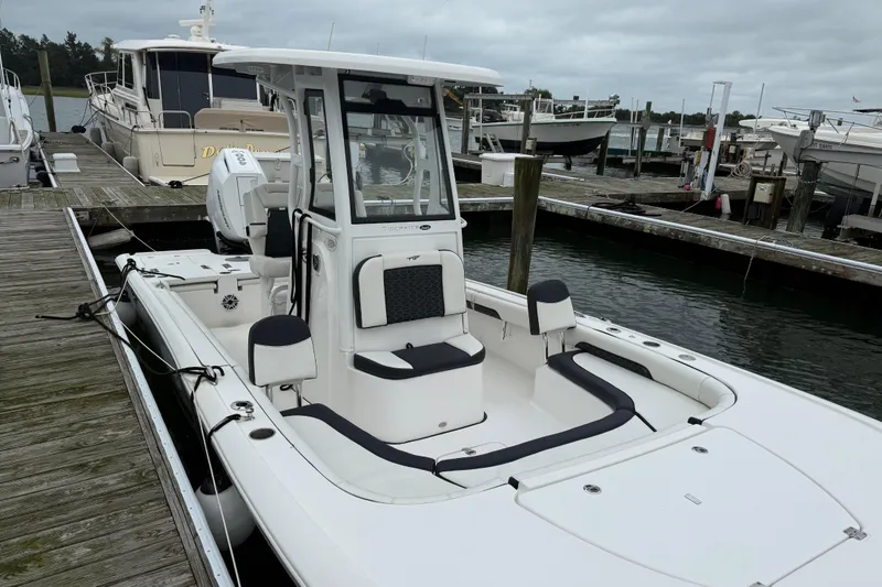 Slide: The Image of 2024 Tidewater 2500 Carolina Bay boat interior with luxurious seating on a sunny day. - 15