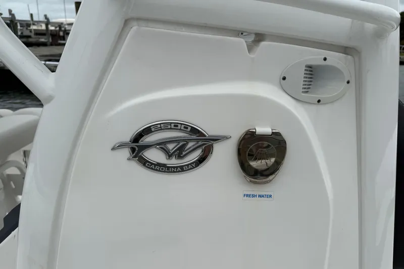 Slide: The Image of 2024 Tidewater 2500 Carolina Bay boat on water, featuring sleek design and modern amenities. - 18