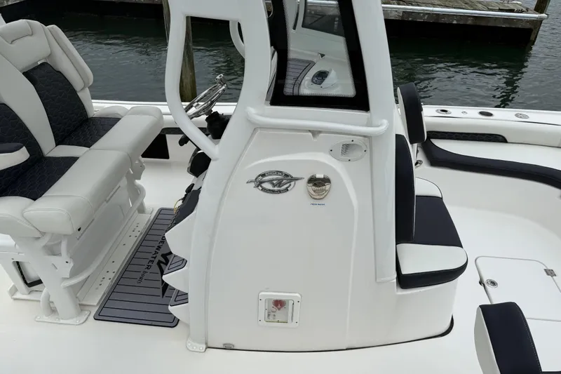 Slide: The Image of 2024 Tidewater 2500 Carolina Bay boat with Mercury engine on a sunny day. - 19