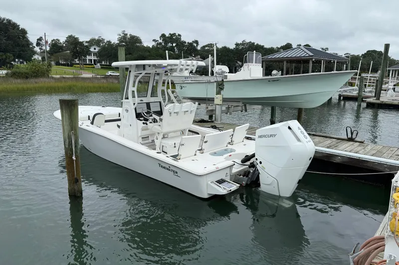 Slide: The Image of 2024 Tidewater 2500 Carolina Bay boat cruising on calm waters. - 3