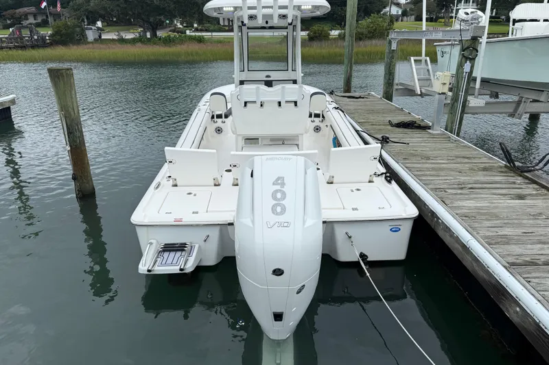 Slide: The Image of 2024 Tidewater 2500 Carolina Bay boat cruising on calm waters. - 4